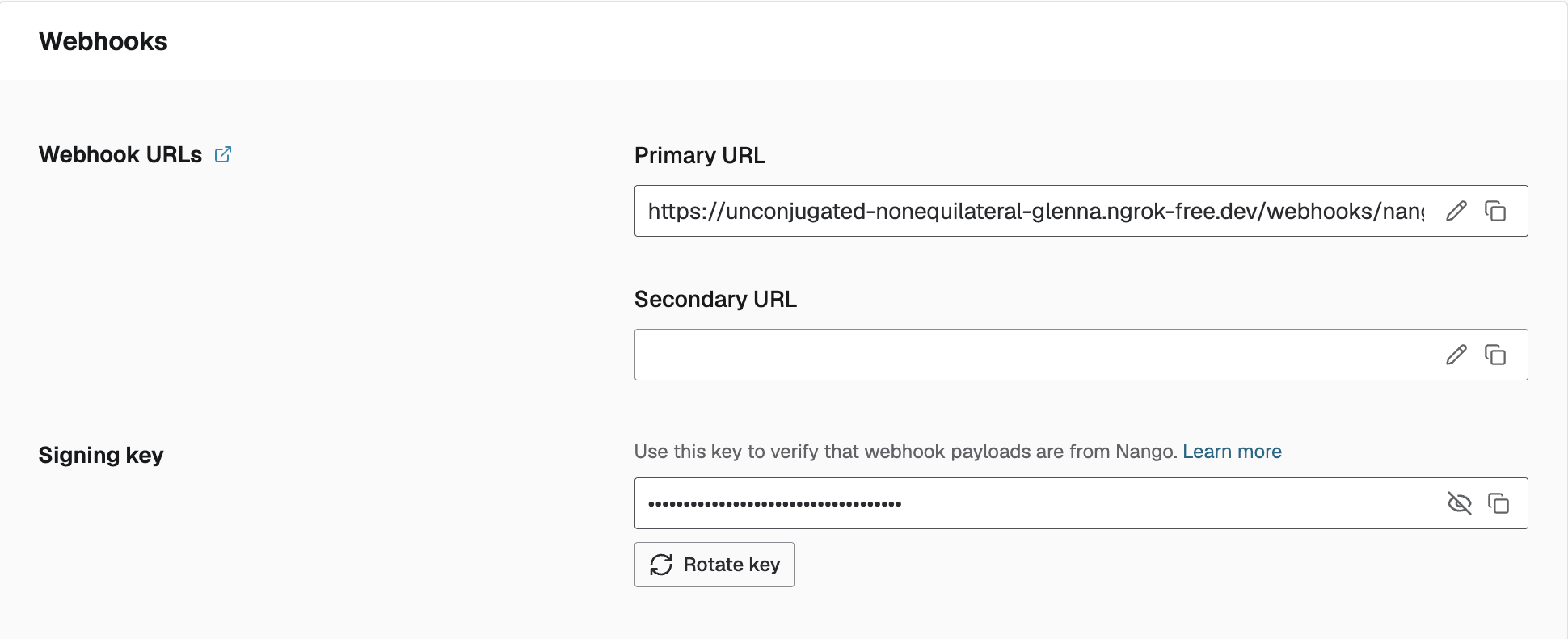 Rotate key button under Environment Settings > Webhooks